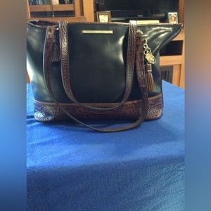 Brahmin shoulder bag with brown trim as shown. Feet on bottom. Good condition.